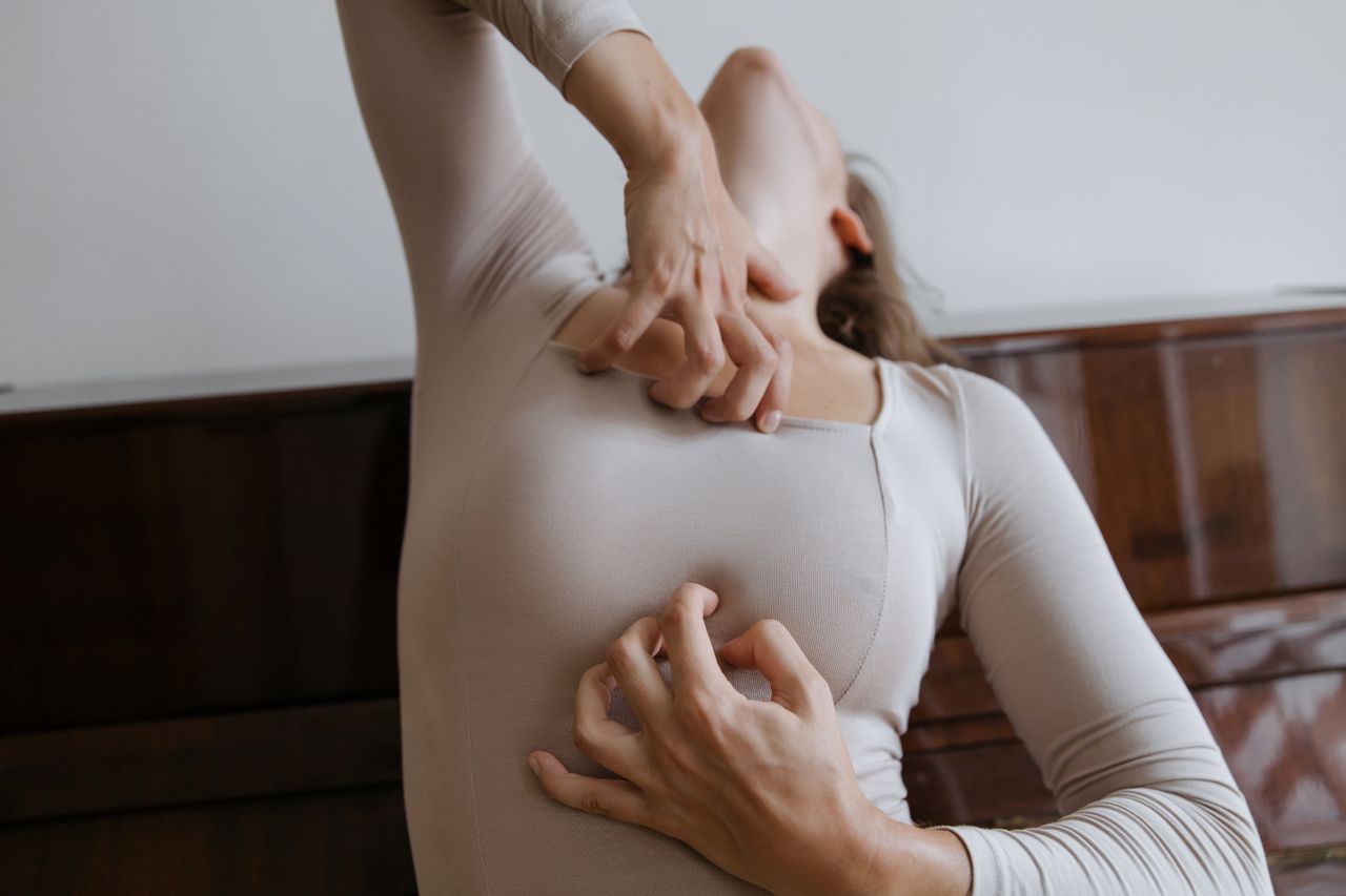 A woman expressing emotion through movement and gestures with body and hands.