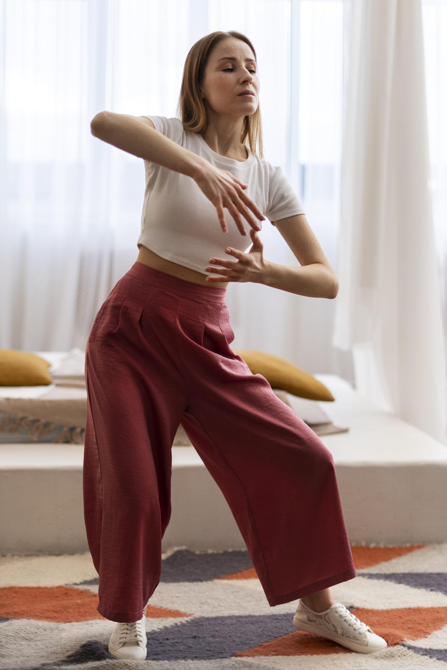 person practicing tai chi indoors